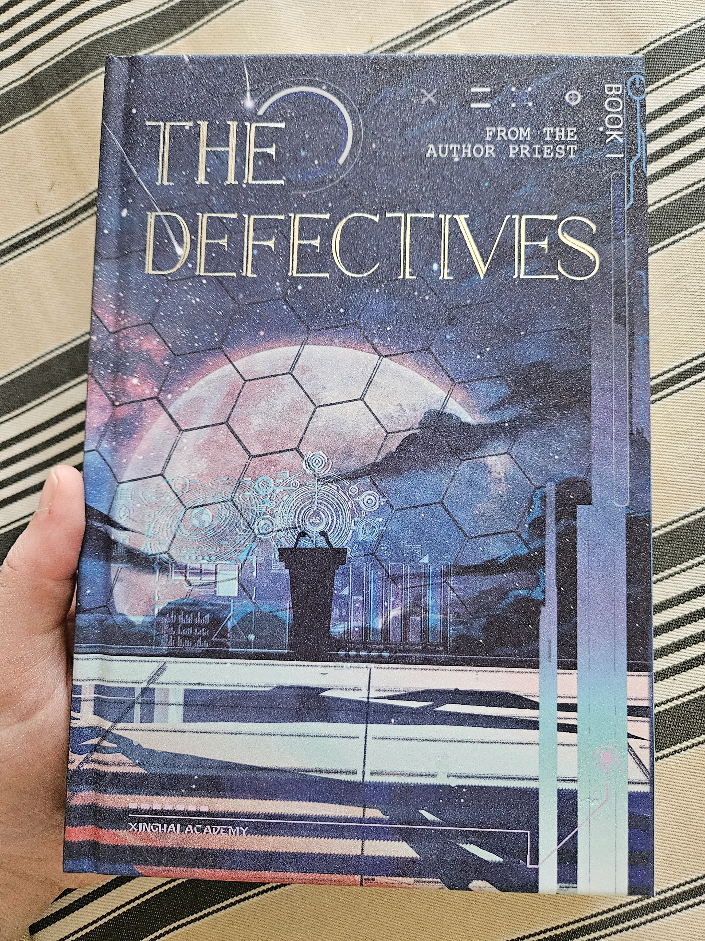 the cover of The Defectives volume one, with its pearlescent shimmer visible