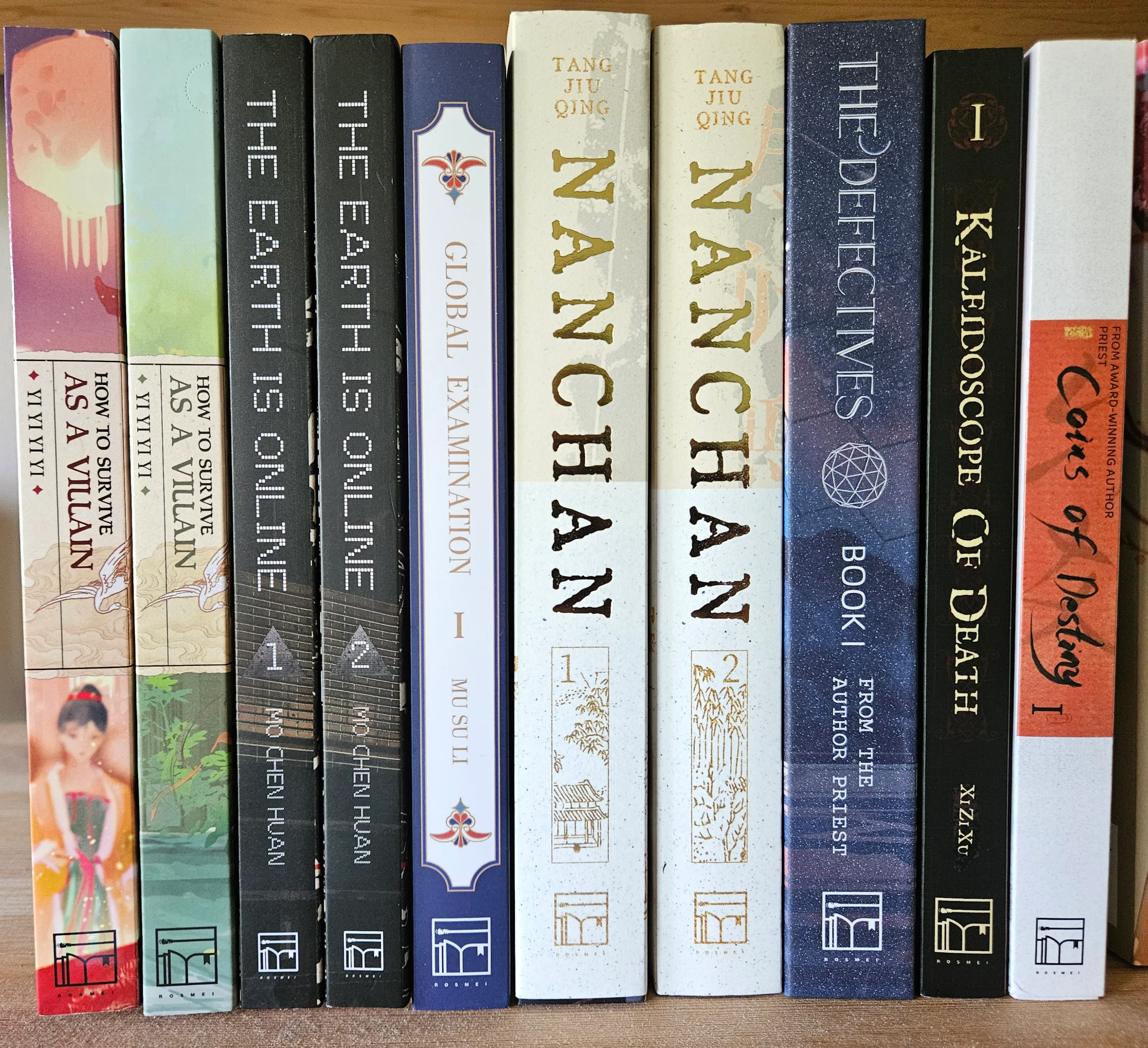 the spines of a number of danmei volumes published by Rosmei